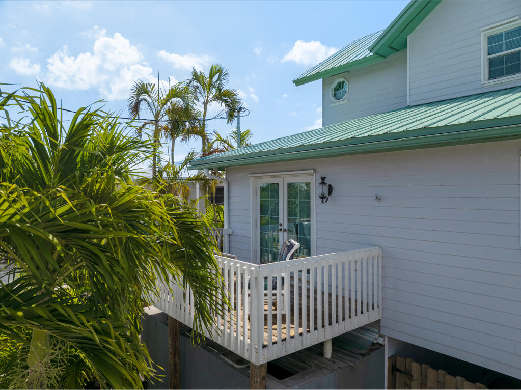 28560 Doubloon Road Summerland Key, FL 33042 - Photo 45 of 52 a view of a chair and table in the balcony