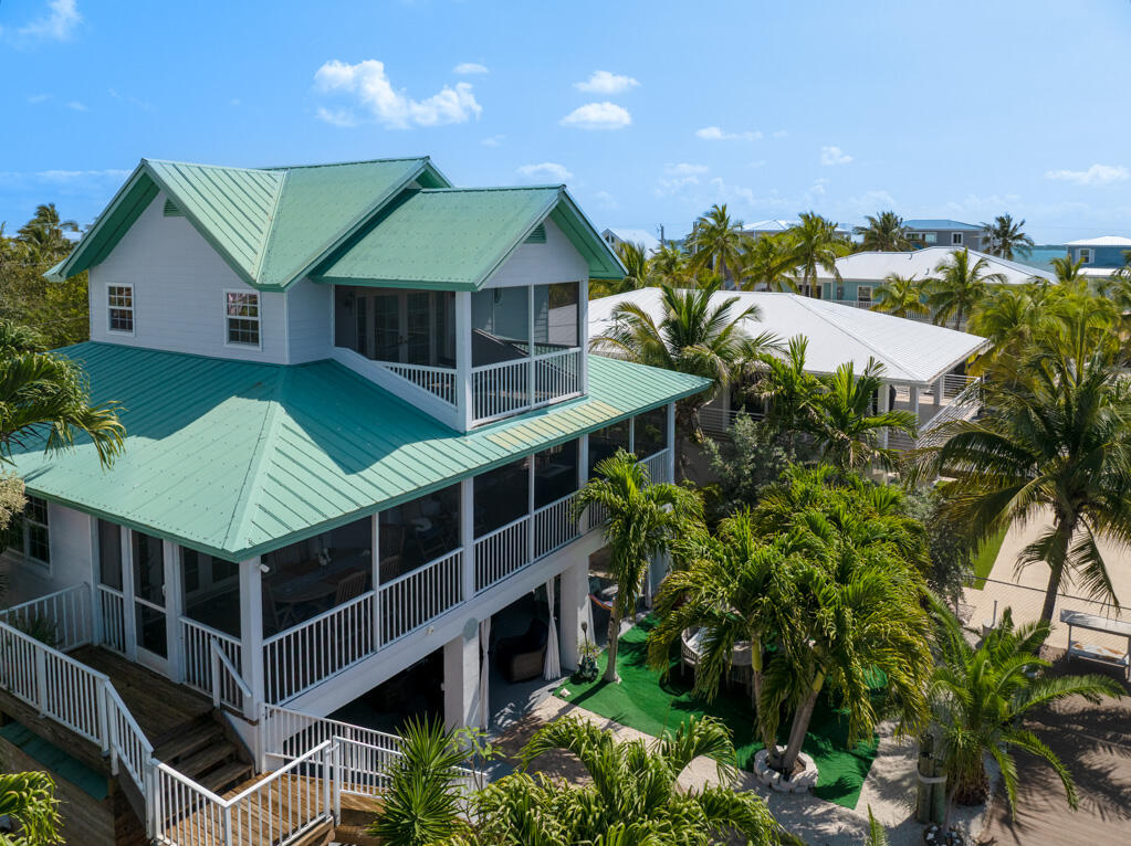 28560 Doubloon Road Summerland Key, FL 33042 - Photo 5 of 52 a aerial view of a house with a yard and potted plants