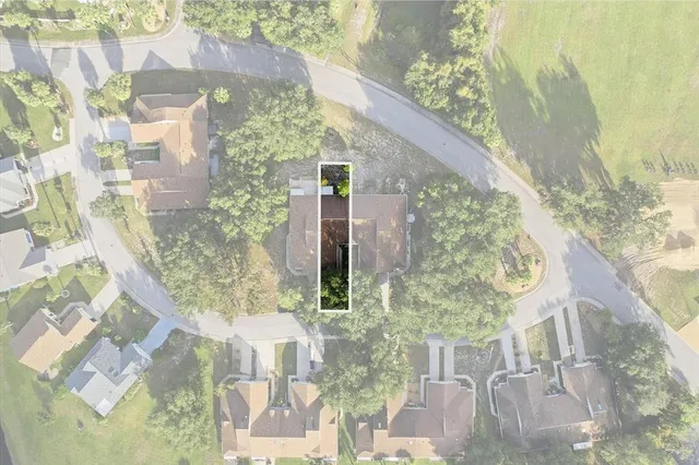 a vase of flowers sitting on a table next to a window