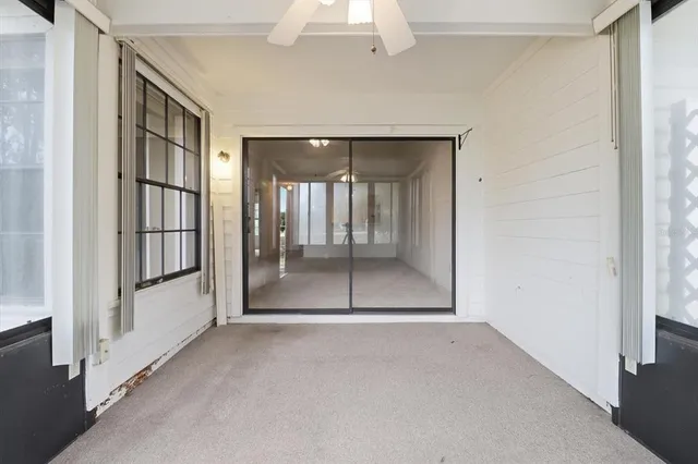 an aerial view of a house with a yard and garden