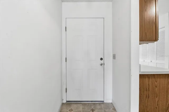 a view of bathroom with a mirror