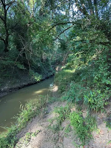 a view of a field with an outdoor space