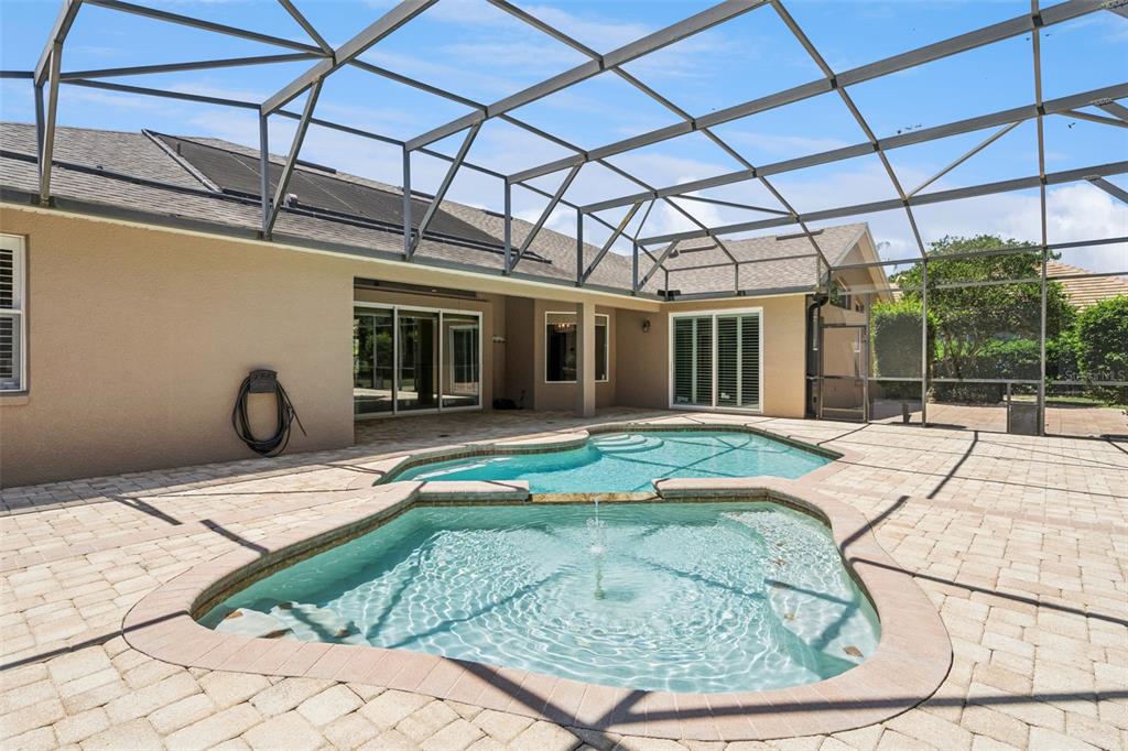 2230 Ridgewind Way Windermere, FL 34786 - Photo 32 of 38 a swimming pool with barbeque oven in front of it