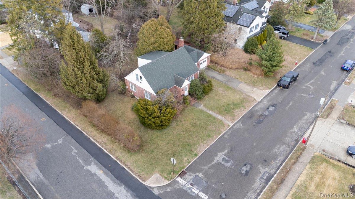 74 Floral Avenue Bethpage, NY 11714 - Photo 4 of 6 a view of a yard with an outdoor space