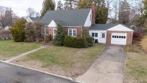 a view of a large house with a yard