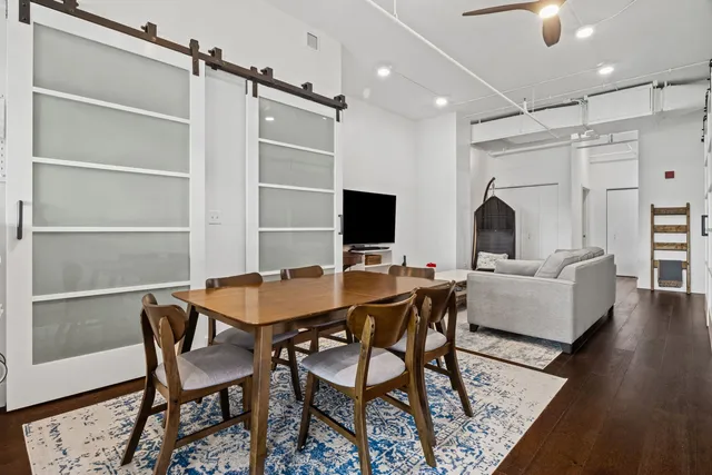 a view of a livingroom with furniture and a flat screen tv