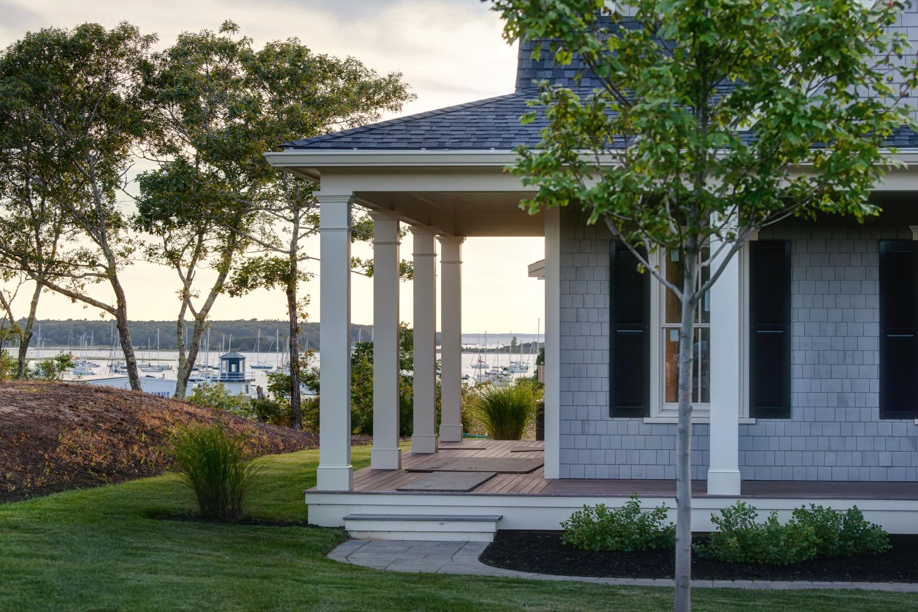 1090 Shore Road, Unit 5 Pocasset, MA 02559 - Photo 3 of 32 a front view of a house with a yard