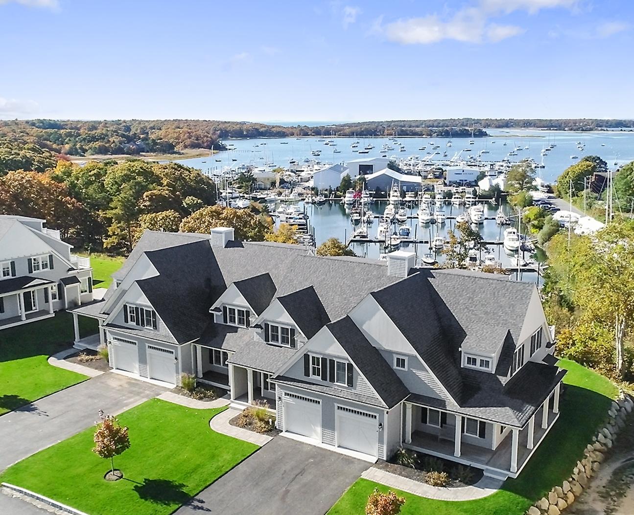1090 Shore Road, Unit 5 Pocasset, MA 02559 - Photo 32 of 32 an aerial view of a house with a garden and mountain view in back