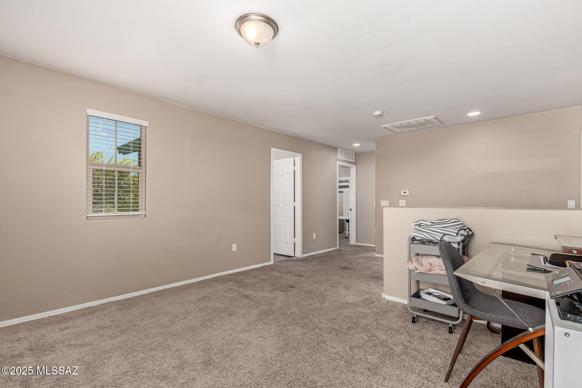 9528 Desert Fauna Loop Tucson, AZ 85747 - Photo 21 of 46 a view of a workspace with furniture