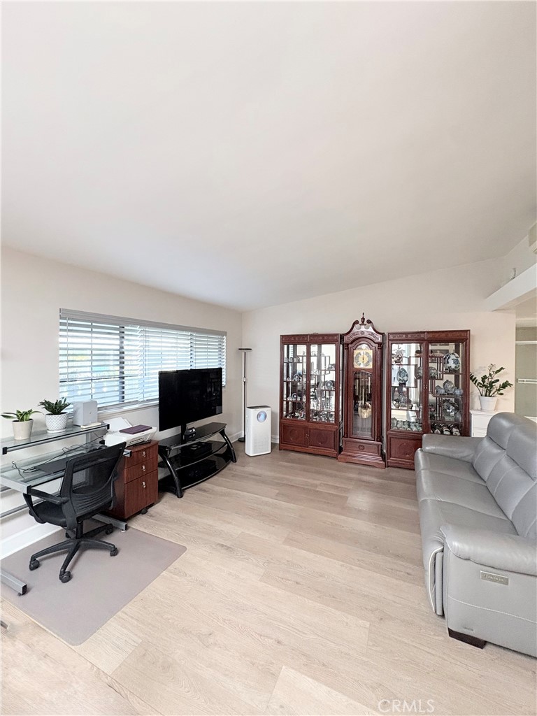 1680 Monterey Road Seal Beach, CA 90740 - Photo 6 of 19 a view of a livingroom with workspace and a couch