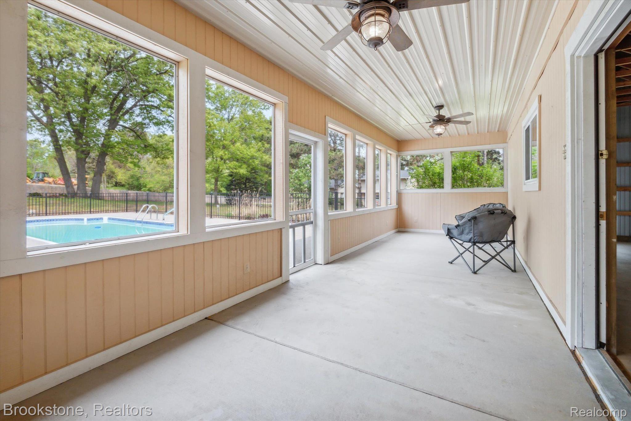 2869 Judah Road Lake Orion, MI 48359 - Photo 39 of 52 SCREENED PORCH OFF POOL HOUSE FOR RELIEF FROM SUN