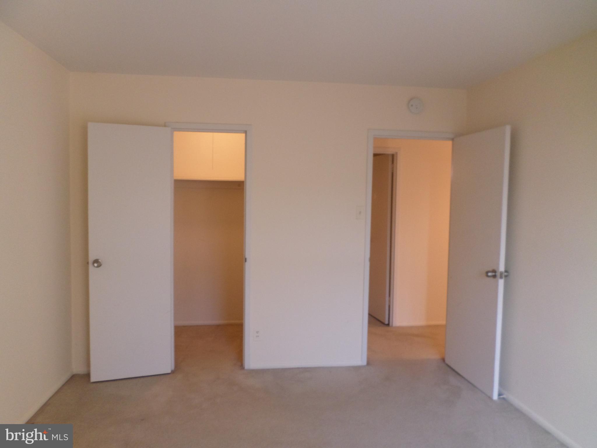 9900 Georgia Avenue, Unit 27707 Silver Spring, MD 20902 - Photo 15 of 29 Bedroom with walk-in closet