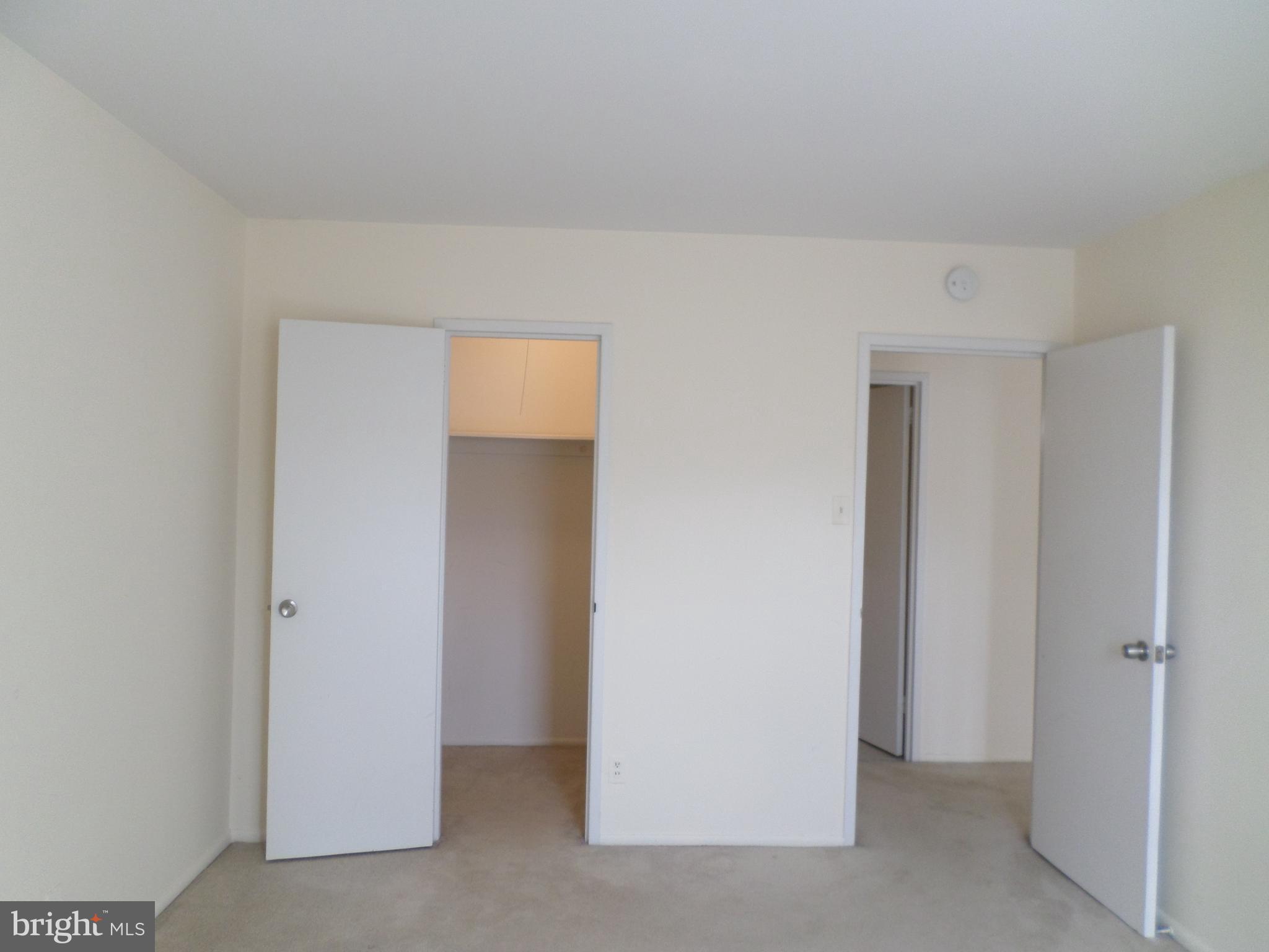 9900 Georgia Avenue, Unit 27707 Silver Spring, MD 20902 - Photo 19 of 29 bedroom, closet & door to hallway