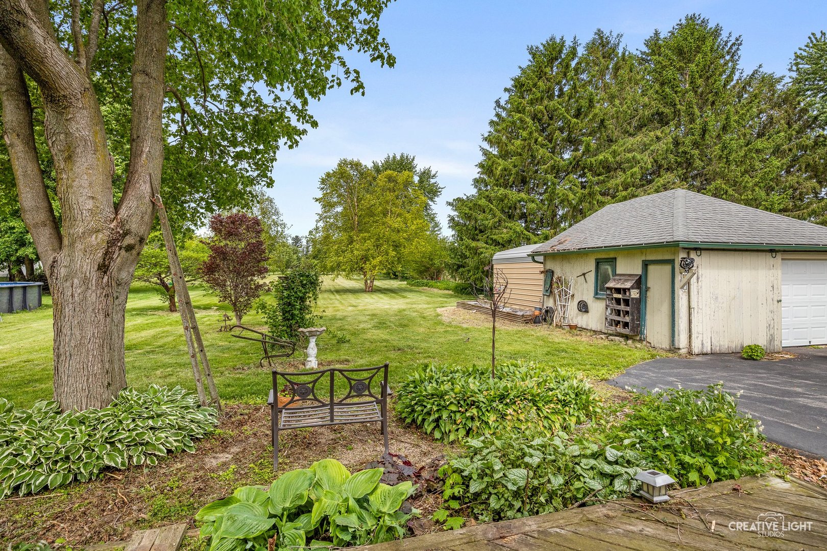 209 North Shabbona Road Shabbona, IL 60550 - Photo 20 of 25 a garden view with a seating space