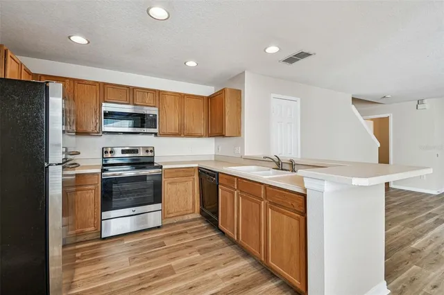 a bathroom with a sink a mirror and a toilet