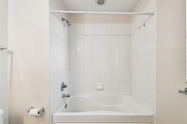 an empty room with large windows