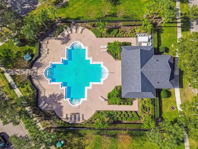 an aerial view of a house with a yard