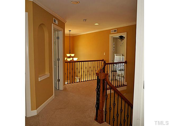 10512 Swerling Way Raleigh, NC 27614 - Photo 16 of 25 Upstairs hall open to foyer.