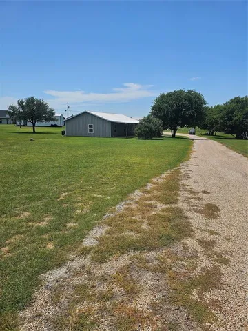 a view of a lake with a big yard