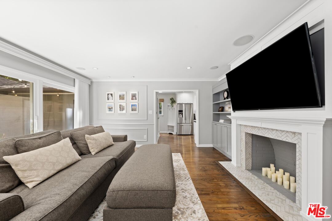 95 Anita Drive Pasadena, CA 91105 - Photo 11 of 31 a living room with furniture and a flat screen tv