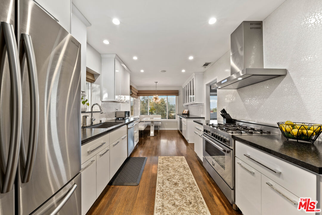 95 Anita Drive Pasadena, CA 91105 - Photo 15 of 31 a kitchen with stainless steel appliances a stove a sink and a refrigerator