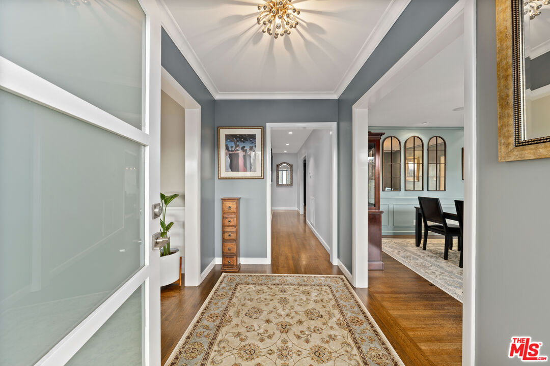 95 Anita Drive Pasadena, CA 91105 - Photo 2 of 31 a very nice looking room with a large window and wooden floor