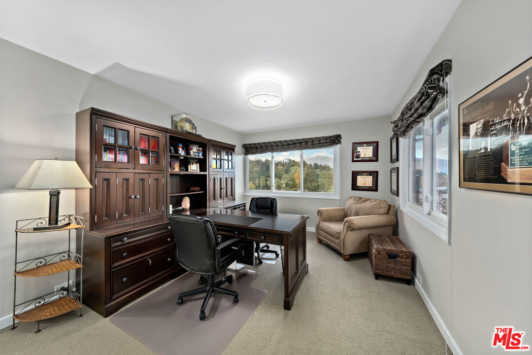 95 Anita Drive Pasadena, CA 91105 - Photo 23 of 31 a view of a livingroom with workspace and a window
