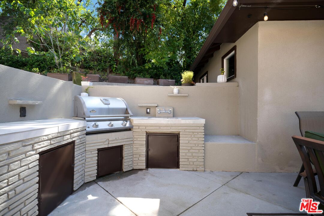 95 Anita Drive Pasadena, CA 91105 - Photo 28 of 31 a kitchen with a stove and a sink