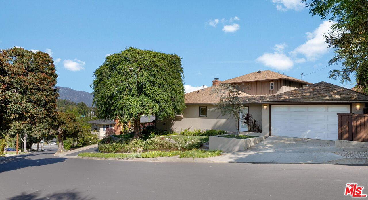 95 Anita Drive Pasadena, CA 91105 - Photo 30 of 31 a view of a house with a street and a yard