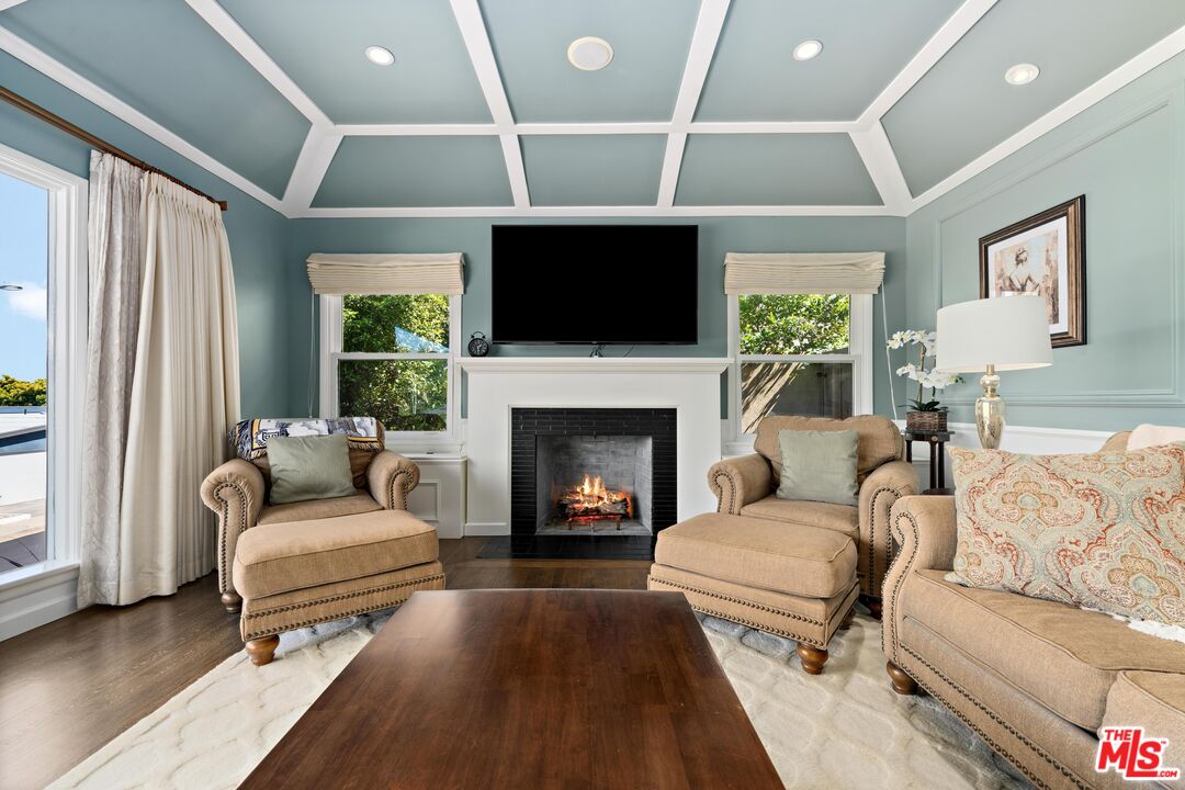 95 Anita Drive Pasadena, CA 91105 - Photo 6 of 31 a living room with furniture flat screen tv and a fireplace