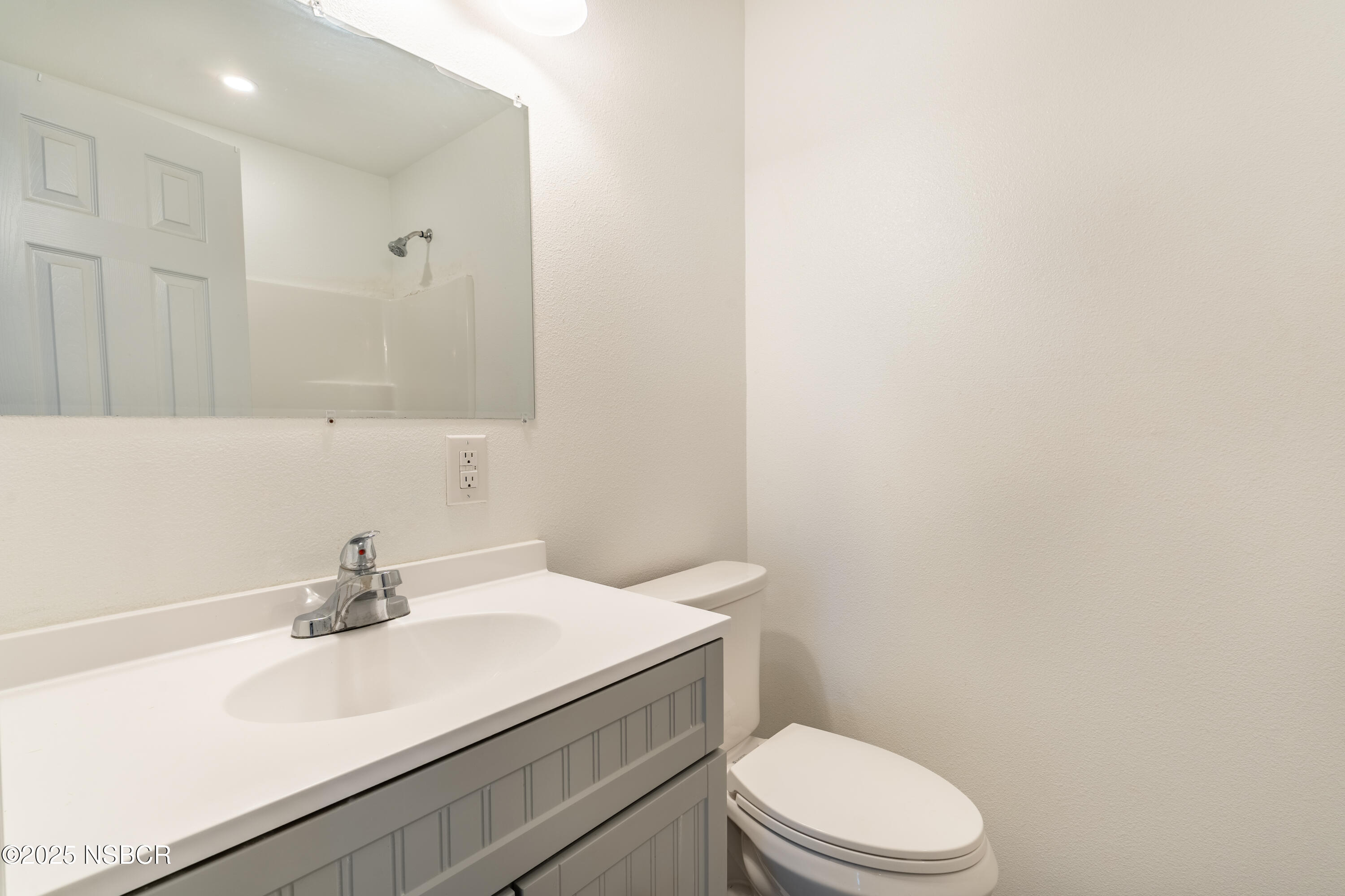 4564 South Bradley Road Santa Maria, CA 93455 - Photo 11 of 16 a bathroom with a sink a toilet and vanity