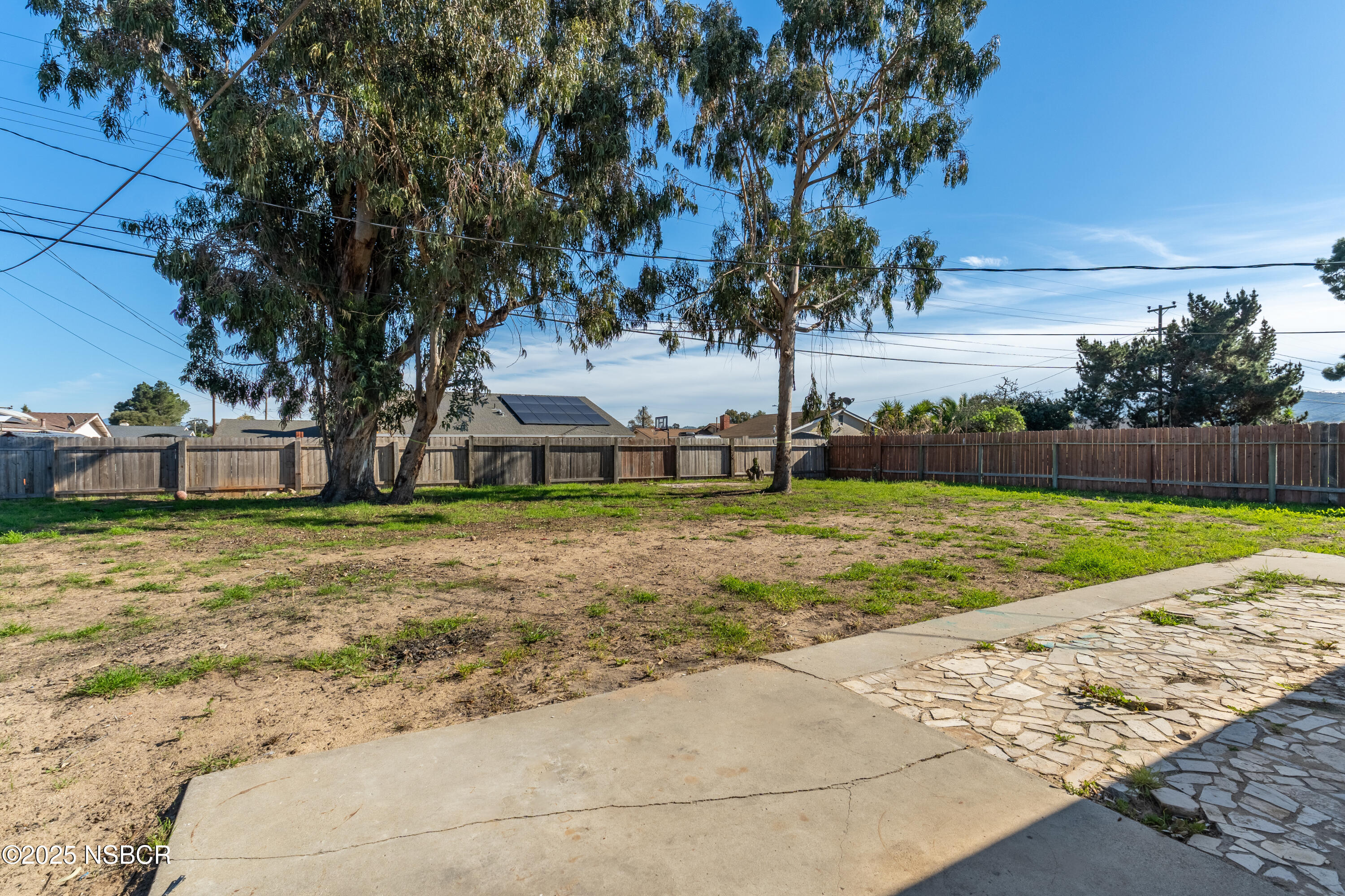 4564 South Bradley Road Santa Maria, CA 93455 - Photo 13 of 16 a view of backyard with large trees