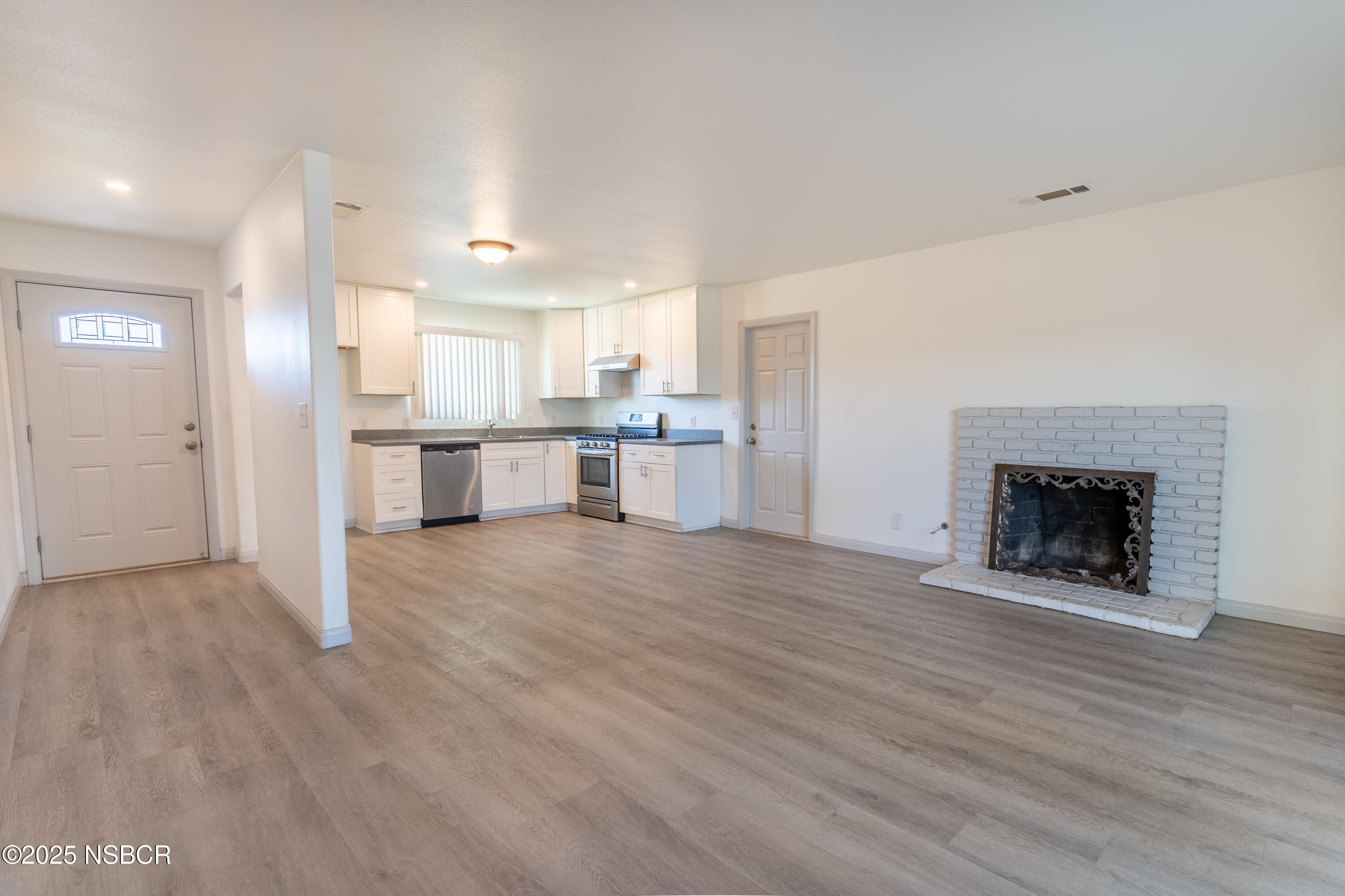 4564 South Bradley Road Santa Maria, CA 93455 - Photo 2 of 16 a view of kitchen with sink and fireplace