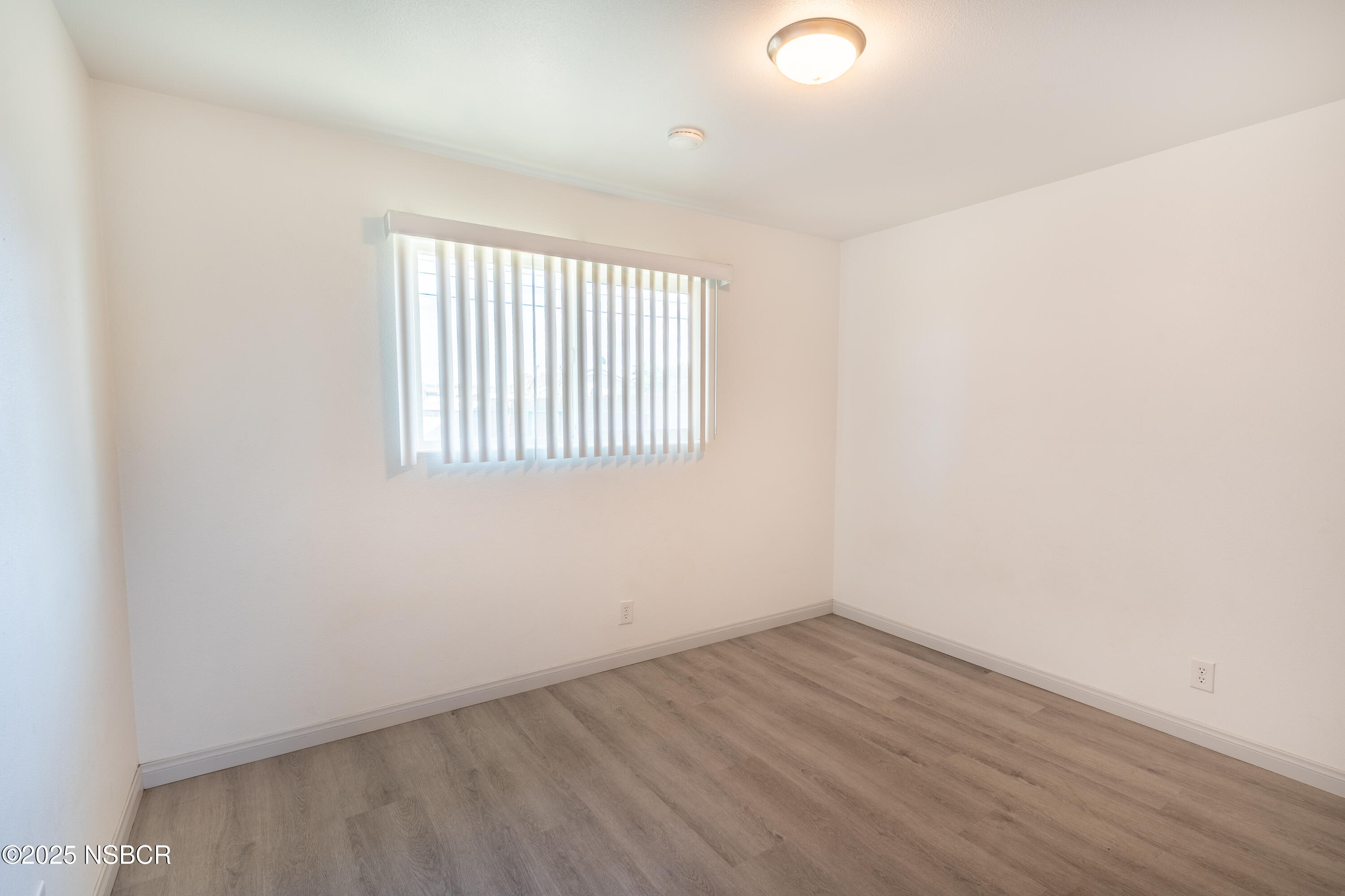 4564 South Bradley Road Santa Maria, CA 93455 - Photo 8 of 16 an empty room with a window