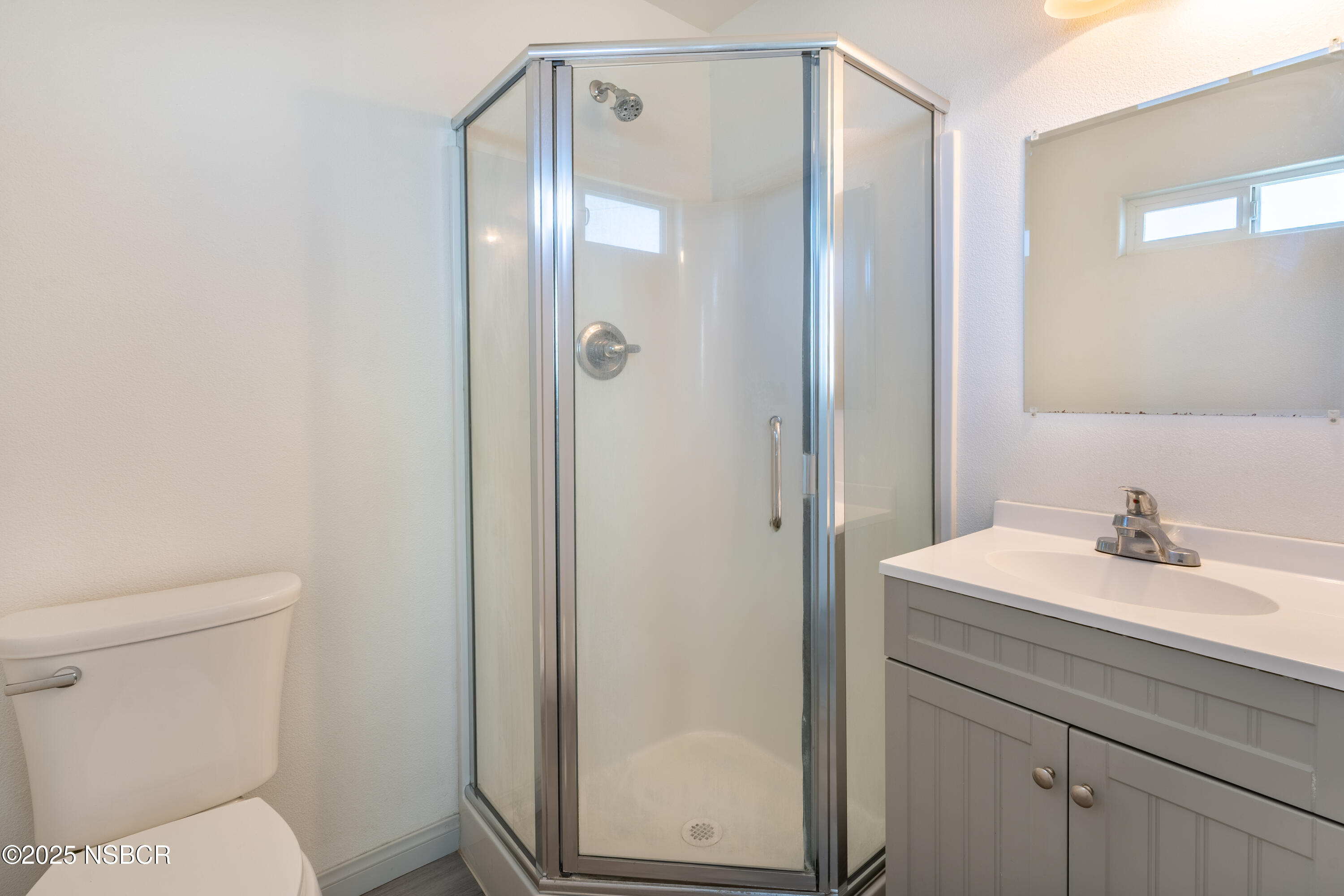 4564 South Bradley Road Santa Maria, CA 93455 - Photo 10 of 16 a bathroom with a sink a toilet and shower