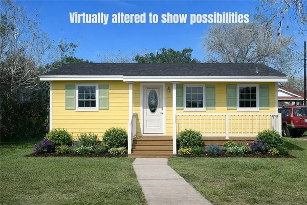 a view of a house with a small yard