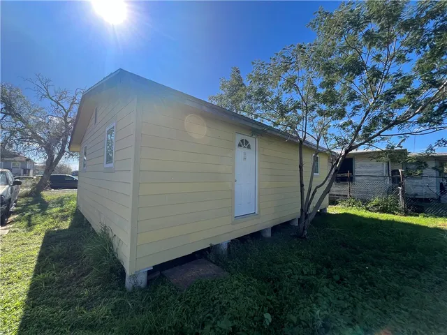 a backyard of a house with lots of green space