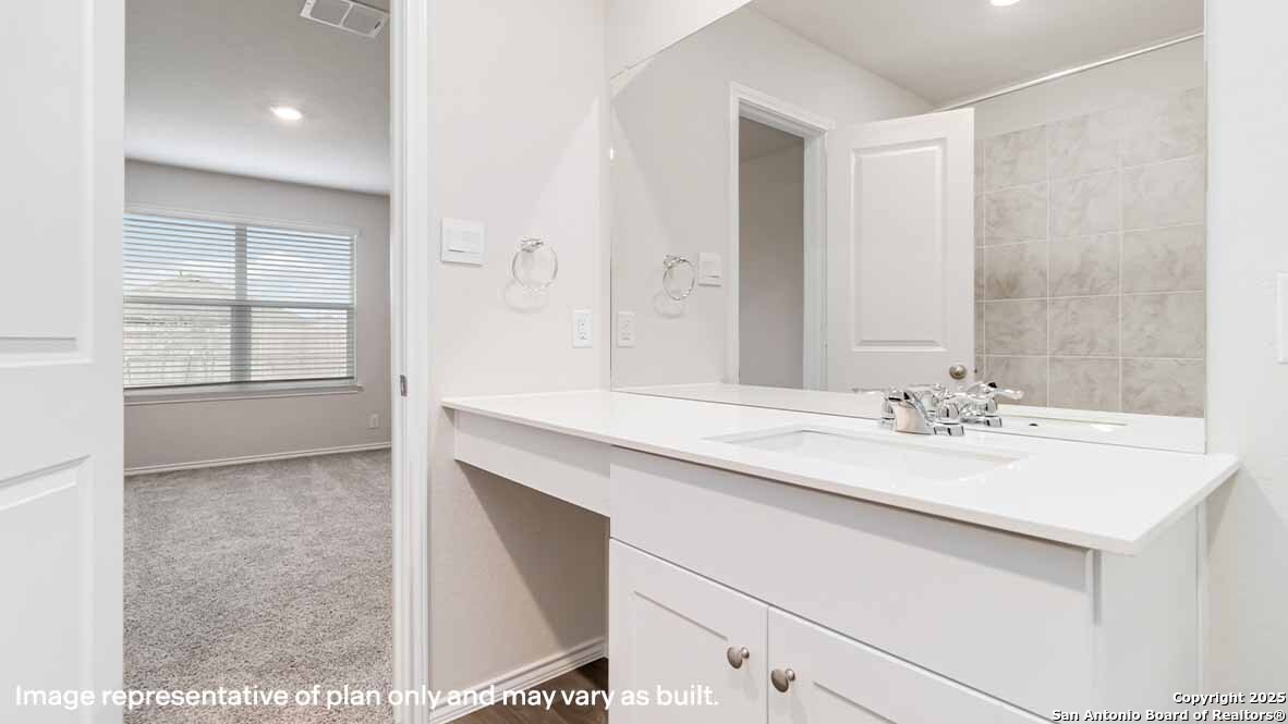 14731 Clay Rdg Run San Antonio, TX 78253 - Photo 21 of 55 a bathroom with a sink and a mirror