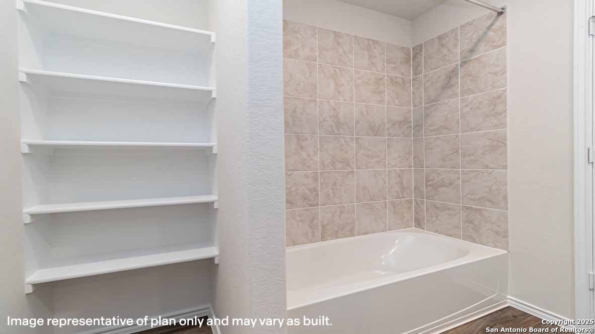 14731 Clay Rdg Run San Antonio, TX 78253 - Photo 22 of 55 a bath tub sitting next to a white sink