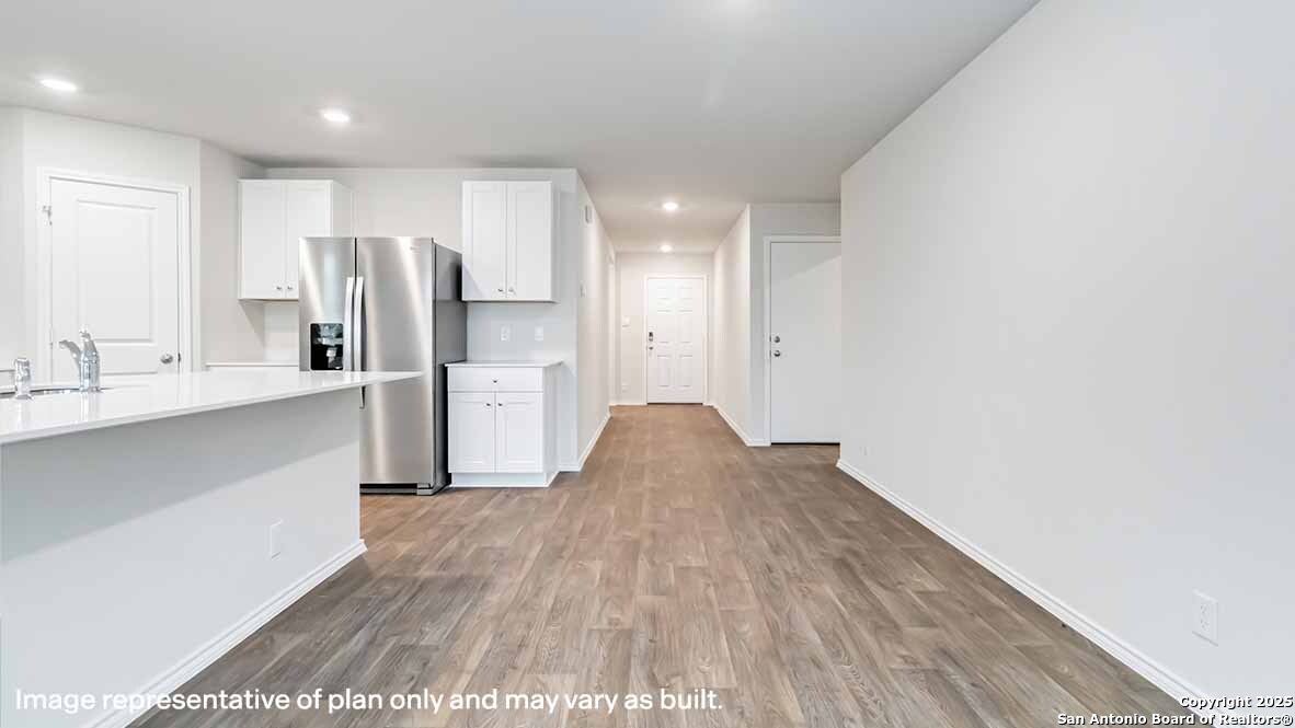 14731 Clay Rdg Run San Antonio, TX 78253 - Photo 3 of 55 a kitchen with stainless steel appliances a refrigerator and a sink