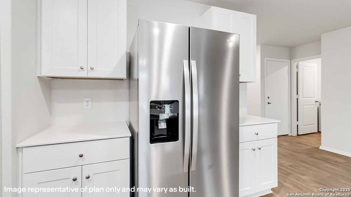 14731 Clay Rdg Run San Antonio, TX 78253 - Photo 10 of 55 a white refrigerator freezer sitting inside of a kitchen