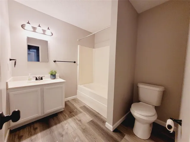 a kitchen with a stove microwave and sink