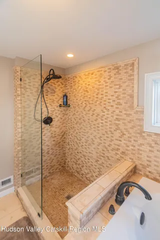 a bathroom with a sink and a shower