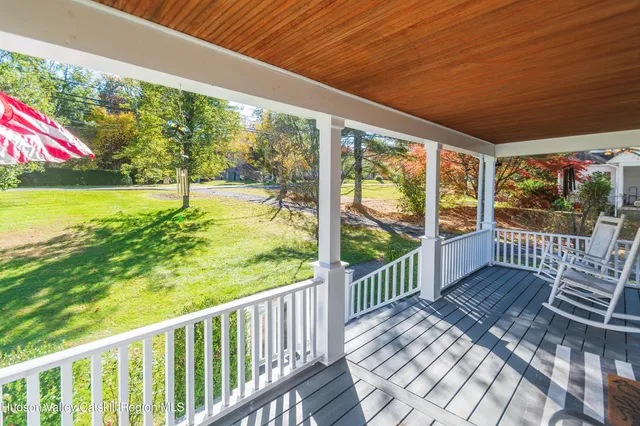 a view of a two chairs in the balcony