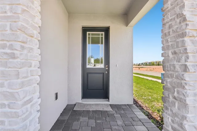 a view of a door and wooden floor