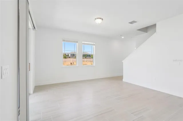 an empty room with windows