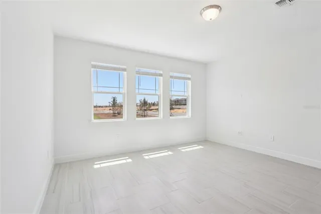 an empty room with windows