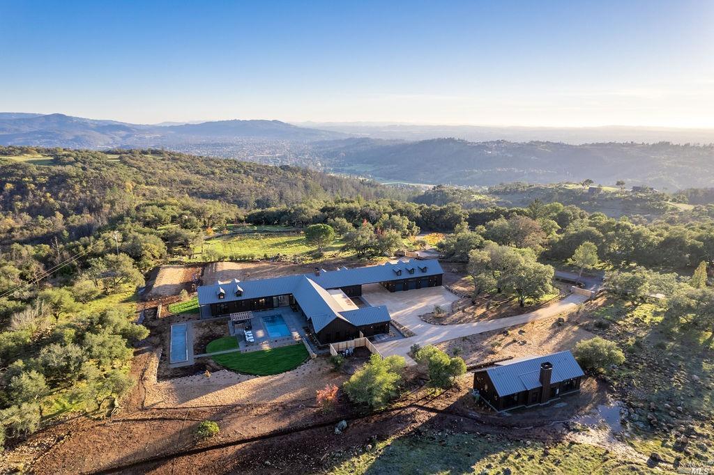 6650 Lower Ridge Road Santa Rosa, CA 95404 - Photo 1 of 1 an aerial view of a house with a mountain