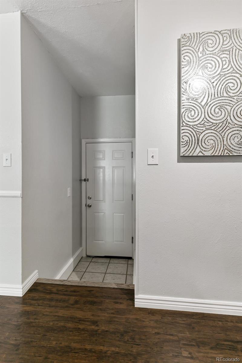 8417 Everett Way, Unit C Arvada, CO 80005 - Photo 20 of 34 a view of empty room with wooden floor