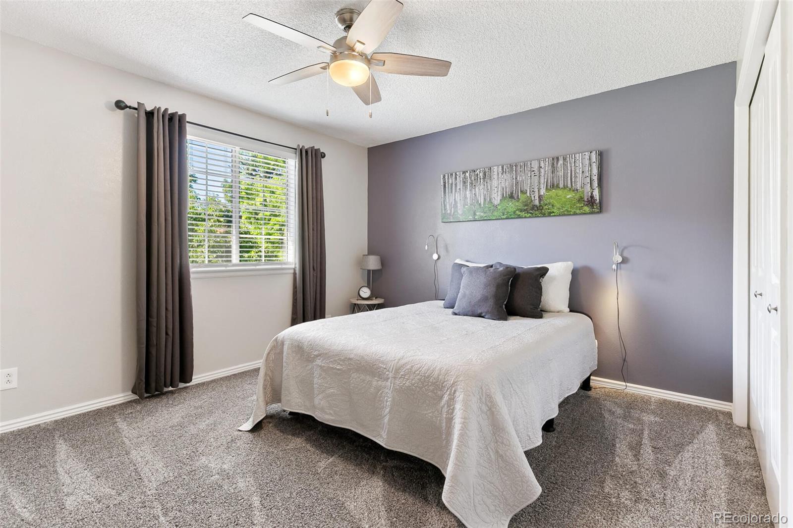 8417 Everett Way, Unit C Arvada, CO 80005 - Photo 23 of 34 a bedroom with a bed and a window